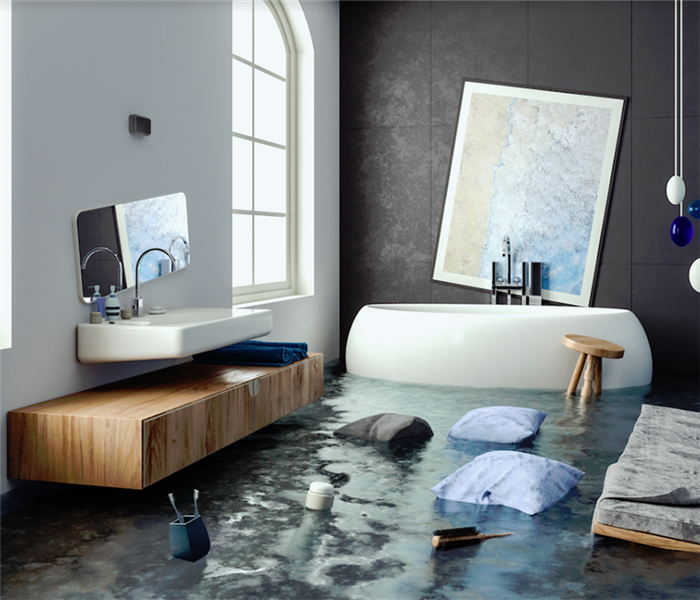 a flooded bathroom with items floating everywhere