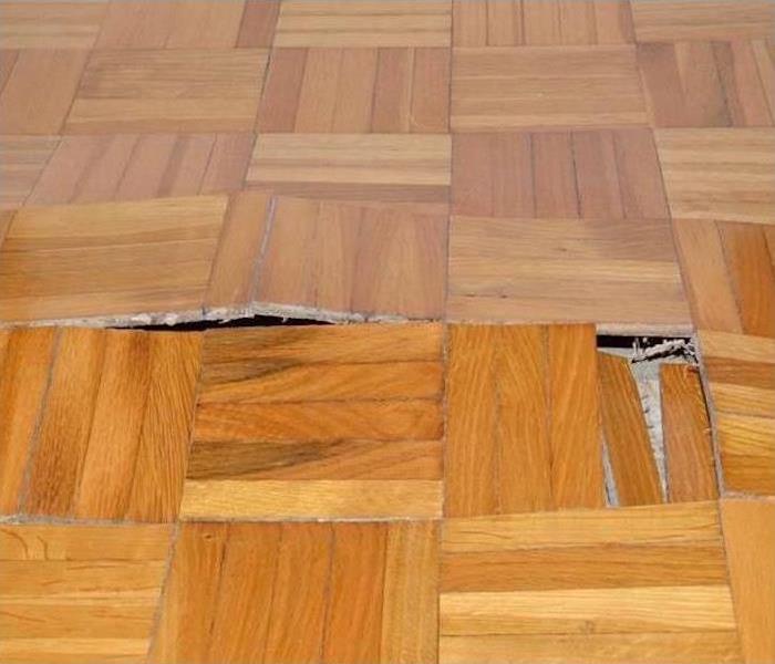 water damaged parquet flooring