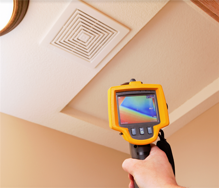 an infrared camera examining the ceiling