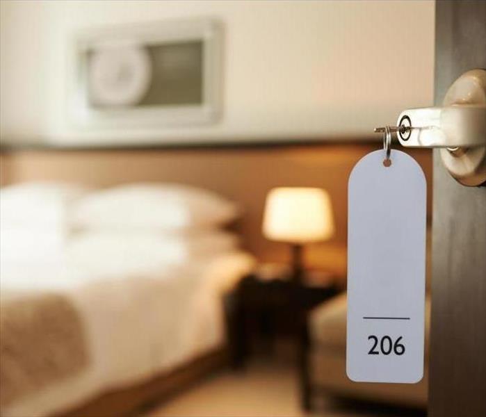 hotel room with key in the door