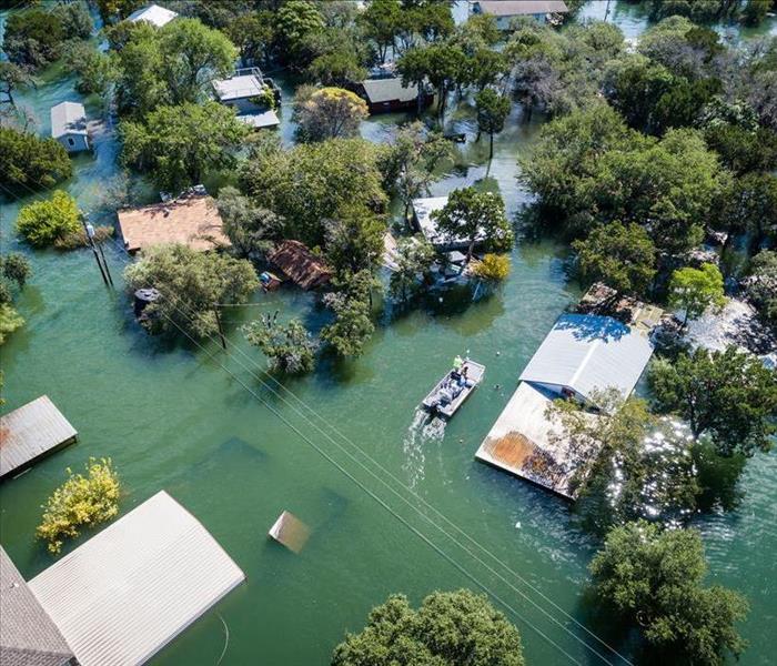 drone view of flooded houses and trees
